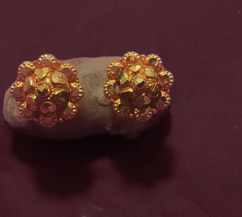 Pair of faceted gold stud earrings